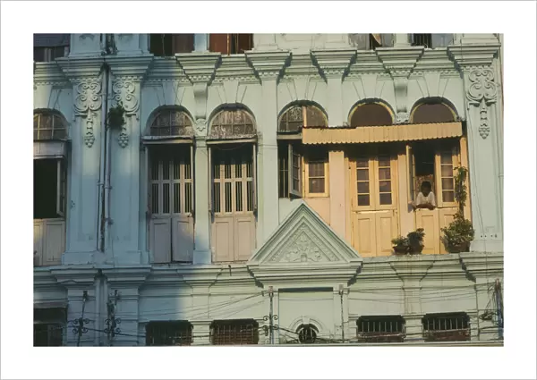 20025885. MYANMAR Yangon Detail of building facade with shuttered windows
