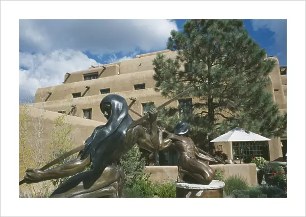 20044961. USA New Mexico Santa Fe Sculptures outside hotel entrance