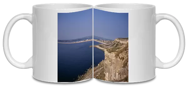 ENGLAND, Dorset, Portland Chesil Beach viewed from quarried cliffs on north west of