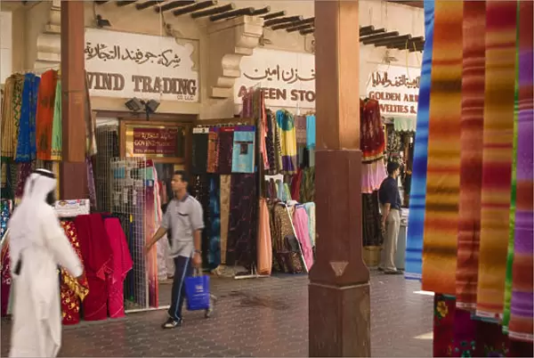 20074387. UAE Dubai Fabric traders and shoppers in Bur Dubai Souq