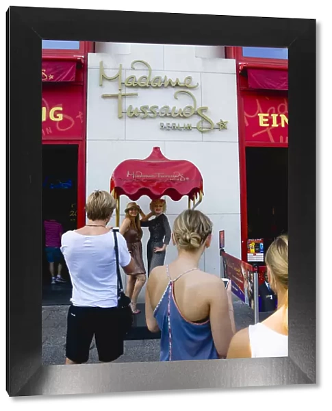 Germany, Berlin, Mitte, outside Madame Tussauds on Unter den Linden tourists have their