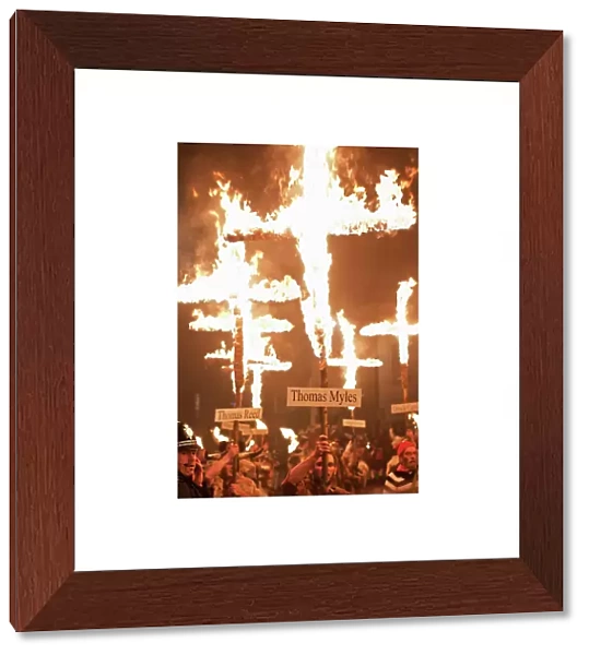 Burning crosses at the annual bonfire night parade held in Lewes, East Sussex