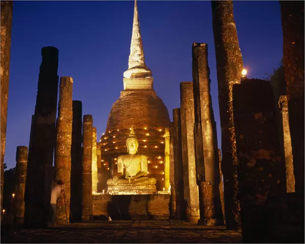 20081253. thailand, sukhothai, colonnade leading to massive seated buddha