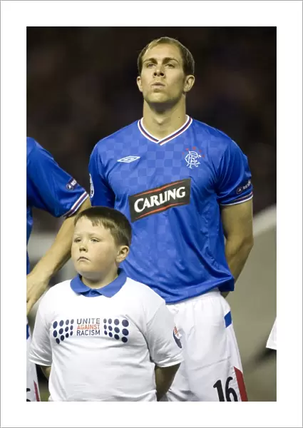 Ibrox Showdown: Rangers FC's Disappointing 1-4 Defeat Against Unirea Urziceni - Group G, Champions League Qualifying Stage: Steven Whittaker and the Rangers Mascot
