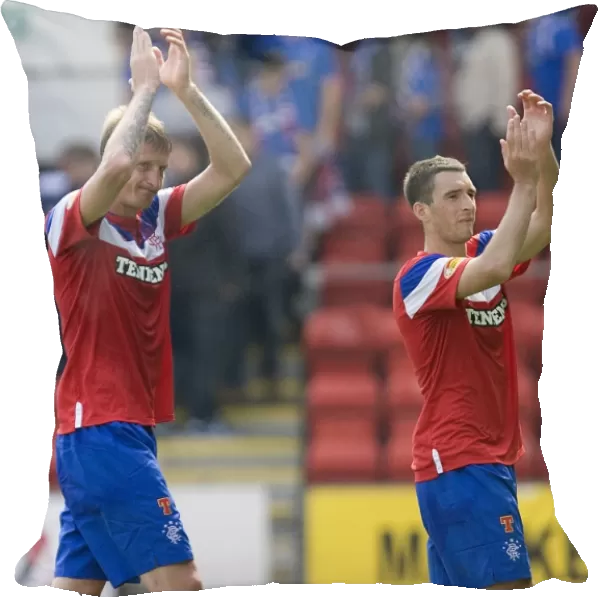 Rangers Football Club: Dorin Goian and Lee Wallace Celebrate 2-0 Victory over St. Johnstone with Fans