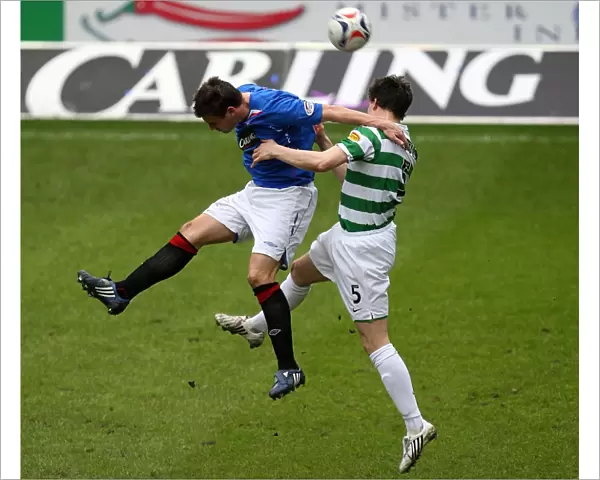 Intense Rivalry: McCulloch vs Caldwell Battle for the Ball in Rangers vs Celtic's 1-0 Ibrox Thriller
