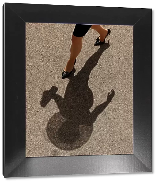 The shadow of a racegoer before the races - Horse Racing