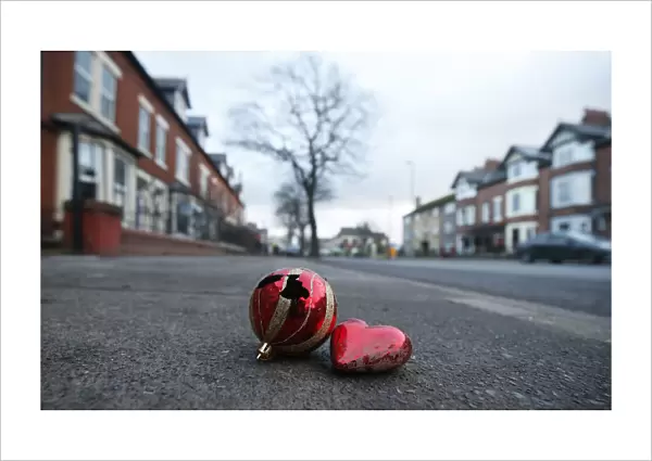 Christmas baubles lie on the pavement along Warwick Road in the town of Carlisle in