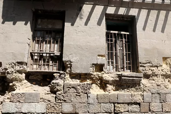Windows of an old house are seen in the Darb al-Labbana hillside neighbourhood in Cairo