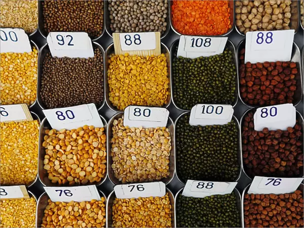 Price tags are seen on the samples of pulses that are kept on display for sale at a