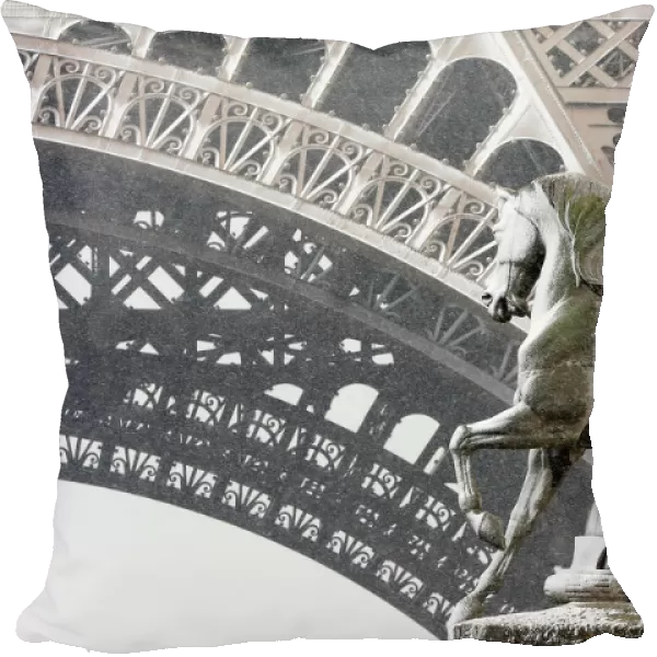 Snow sticks to the statue of a horse next to a roman warrior on the Pont d Iena bridge