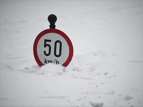 A road sign is seen submerged in snow in Dublin