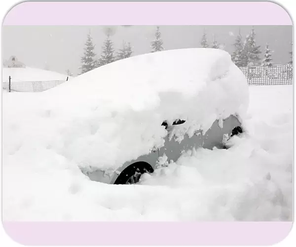 A car is seen during heavy snowfall in Claviere