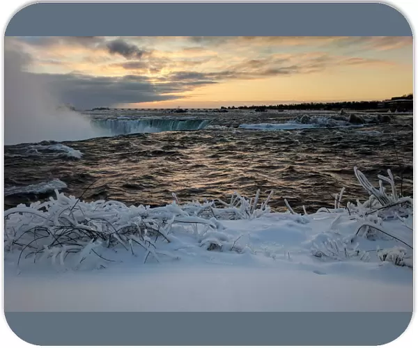 Ice and snow cover areas near the brink of the Horseshoe Falls in Niagara Falls on the