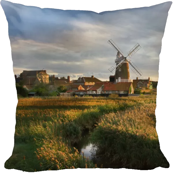 Reedbed and Cley Mill at Cley North Norfolk on a stormy evening in October
