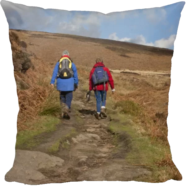 Two ramblers, walking on eroded path in upland habitat, Derwent Valley, Peak District, Derbyshire, England, march