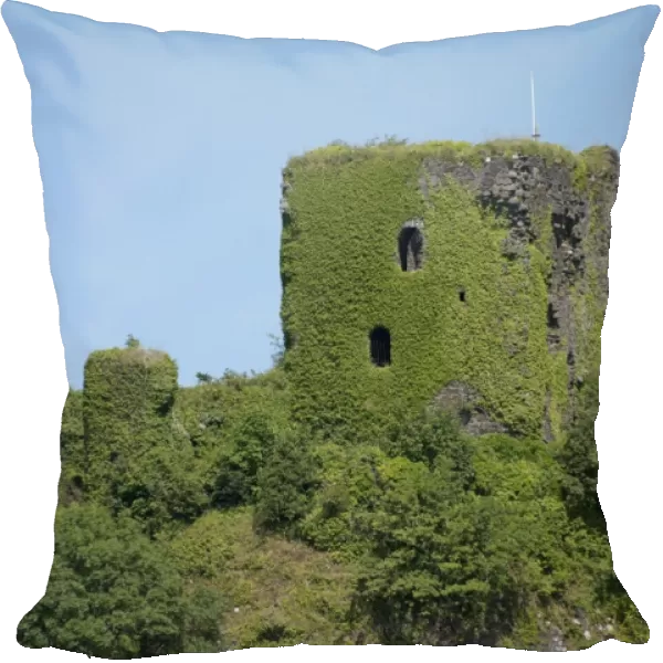 View of ivy covered castle ruins on hill in coastal bay, Dunollie Castle, near Oban, Firth of Lorn, Argyll and Bute