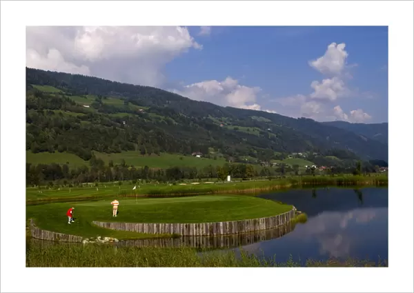 Beautiful golf with golfers at the #18 hole at exclusive Golf Club Murau Kreischberg