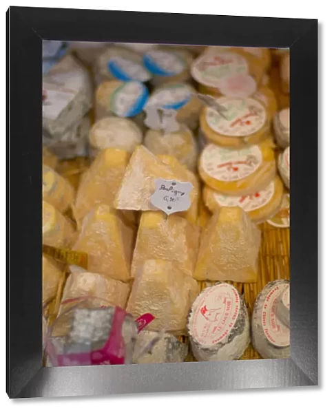 03. France, Paris, variety of cheese for sale in cheese shop