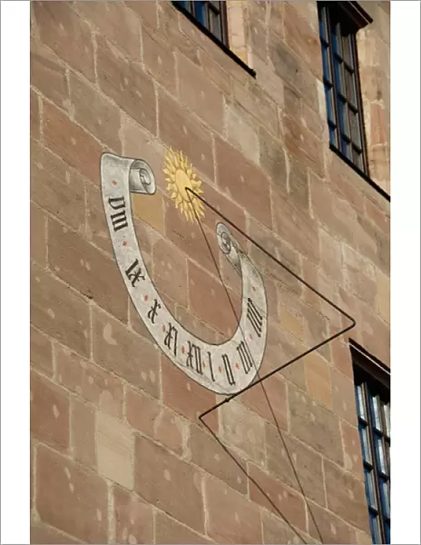 Germany, Bavaria, Nuremberg. Market Square, historic sundial on building wall