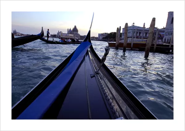 Europe, Italy, Venice. Typical sunset gondola ride through the canals of Venice