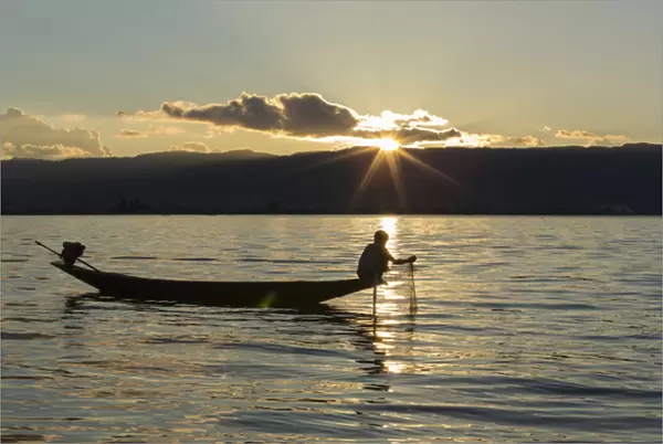 Myanmar, Inle Lake. Fisherman at sunset on Inle Lake