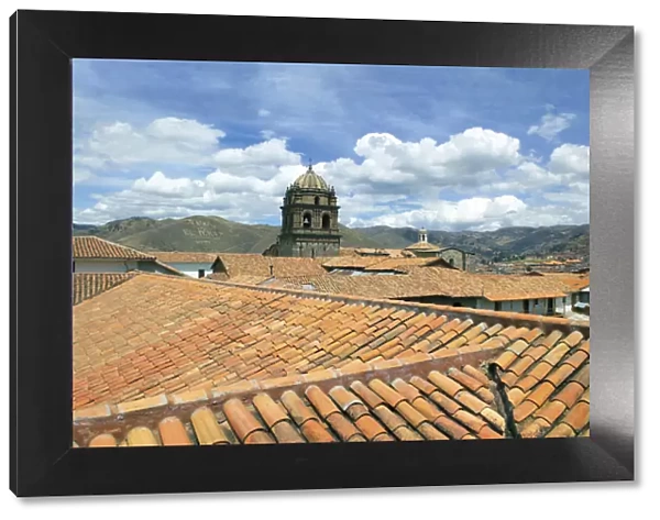 Cusco, Peru, red tiled rooftops and the Cusco Cathedral and mountains