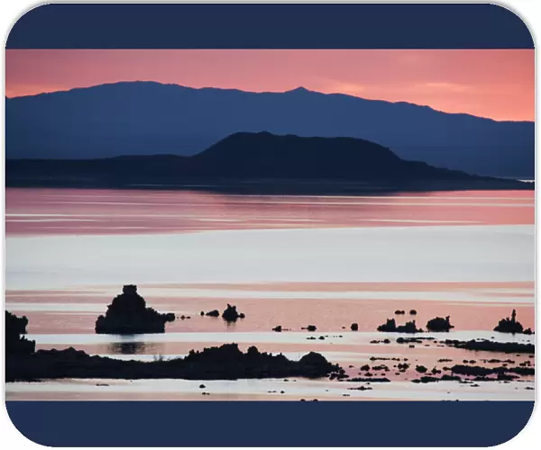 USA, California. Predawn light at Mono Lake silhouettes tufas