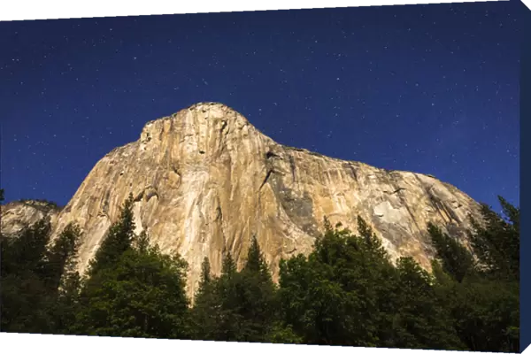 El Capitan under a starry moonlit night (climbers headlamps visible), Yosemite National Park