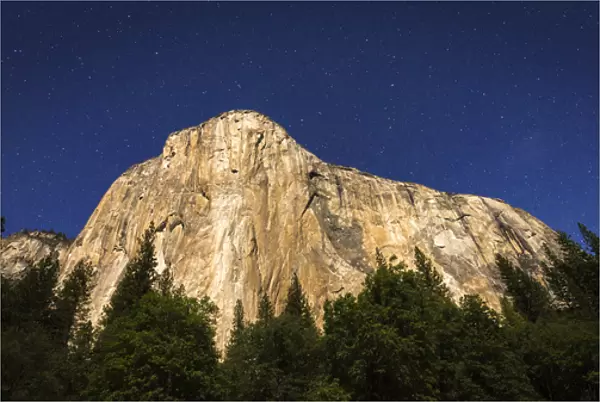 El Capitan under a starry moonlit night (climbers headlamps visible), Yosemite National Park