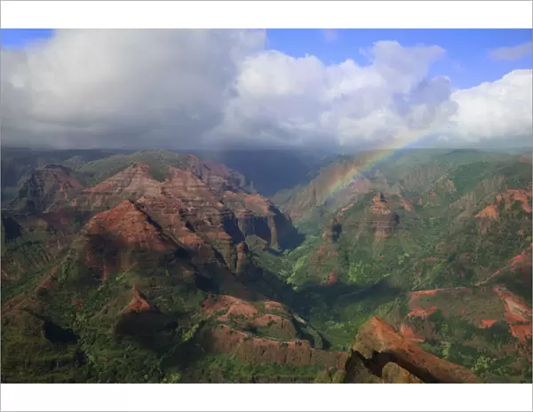 USA, Hawaii, Kauai. Rainbow and clouds over Waimea Canyon