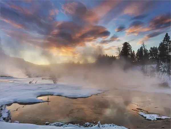 Brilliant sunrise clouds over Grassy Spring at Mammoth Hot Springs in Yellowstone National Park