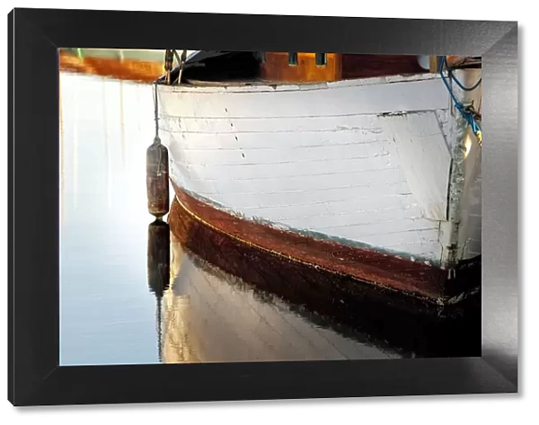 USA, Washington State, Seattle. Wooden boat reflects on lake