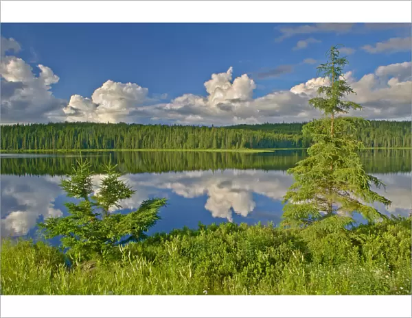 Canada, Ontario. Clouds reflected in Trail Lake. Credit as