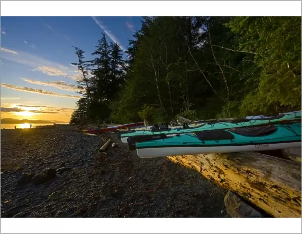 Canada, British Columbia, Vancouver Island, Johnstone Strait. Sea kayaks and sunrise