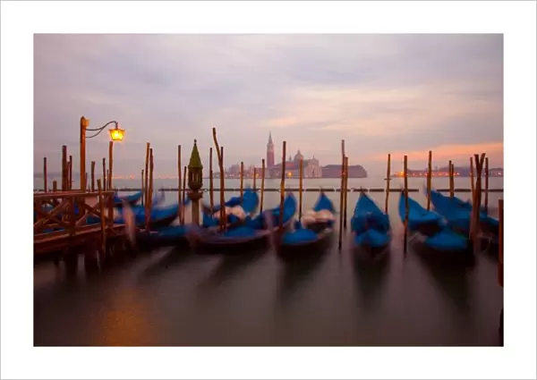 Italy, Venice. Anchored gondolas at twilight. Credit as: Jim Zuckerman  /  Jaynes Gallery