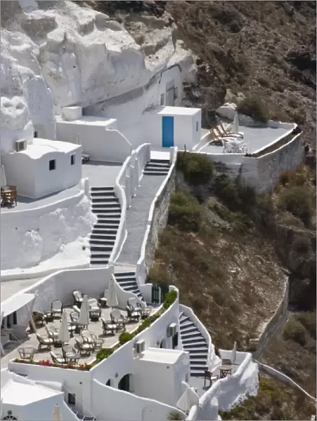 Greece, Santorini, Thira, Oia. Stairs connecting different levels of a large white