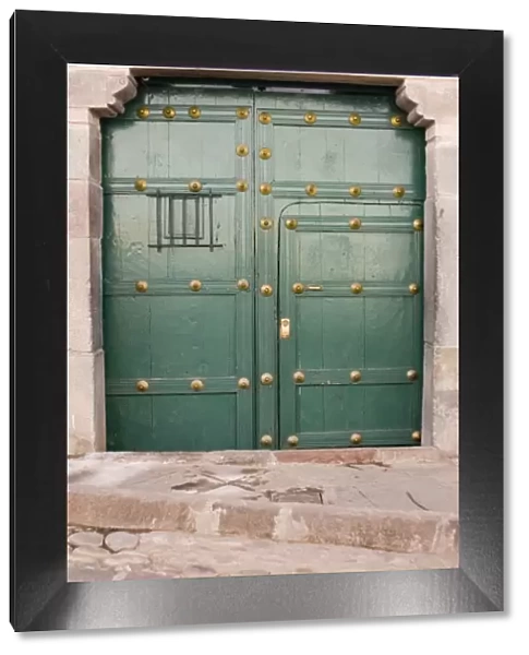 South America - Peru. Green residential door in Cusco