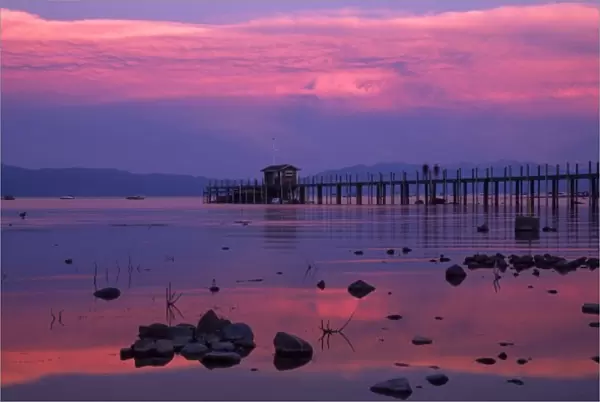 USA. California. Lake Tahoe. The sunset washes the water and pier in hues of pink and blue