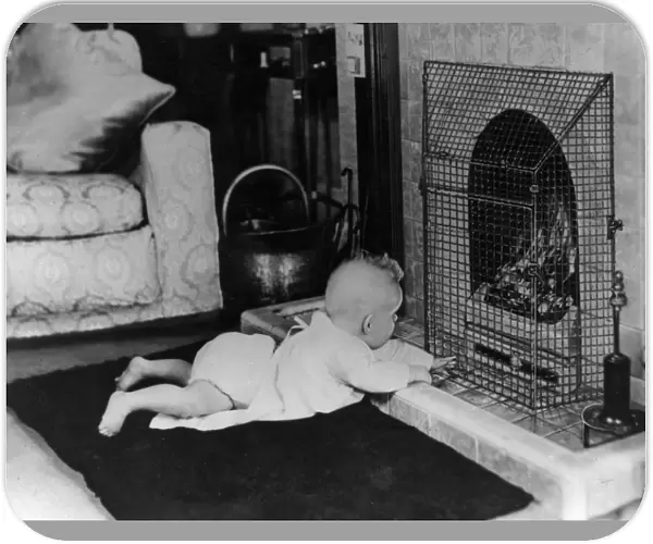 Fire safety -- baby playing near guarded coal fire
