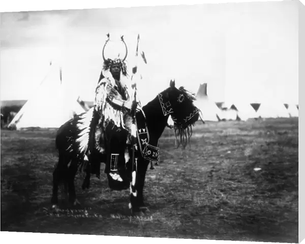CAYUSE CHIEF, c1900. David Young, a Cayuse Native American chief, riding a horse