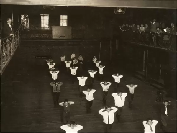 HINE: GYM CLASS, 1910. Boys exercising in a gym class at the Henry St