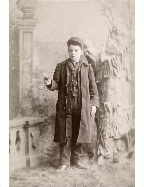 MESSENGER BOY, c1889. Portrait of a messenger boy, photographed by the Shouldis