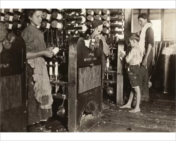 HINE: CHILD LABOR, 1908. Young doffers working at their machines at the Cherryville Mfg