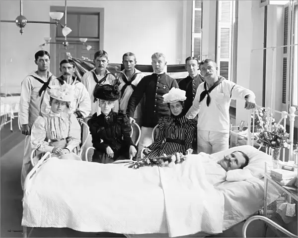 BROOKLYN: HOSPITAL, c1900. Sailors and women visiting a patient at the Brooklyn