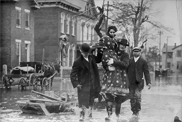 DAYTON FLOOD, 1913. Rescue workers carrying a woman after the flood in Dayton, Ohio