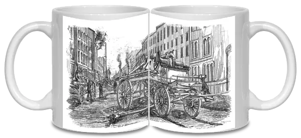 FIREFIGHTING, 1860. A series of fire engines and a water tower fighting a fire