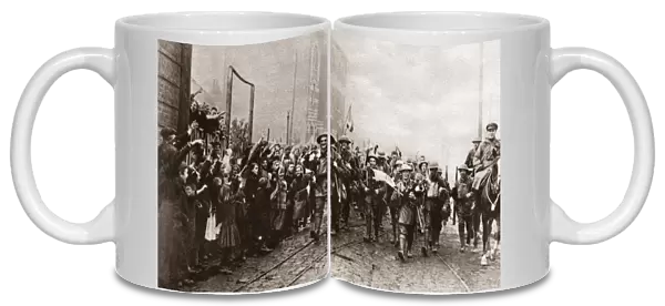 WORLD WAR I: LILLE, 1918. Inhabitants of Lille, France, cheering British soldiers, 1918