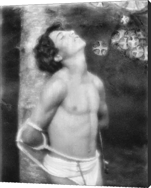 DAY: SAINT SEBASTIAN, c1906. Saint Sebastian tied to a tree with arrows in his stomach and side