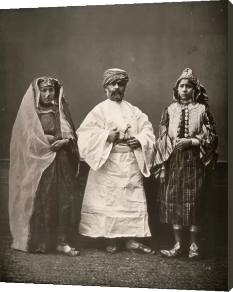 MIDDLE EASTERN DRESS, c1873. Models wearing traditional clothing from the Middle East